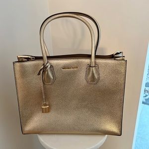 Michael Kors brand new gold metallic purse.